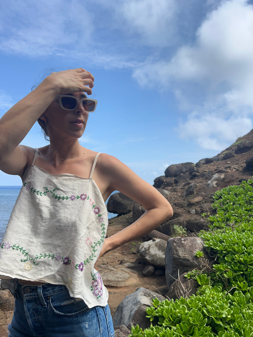 A floral embroidered tie back tank