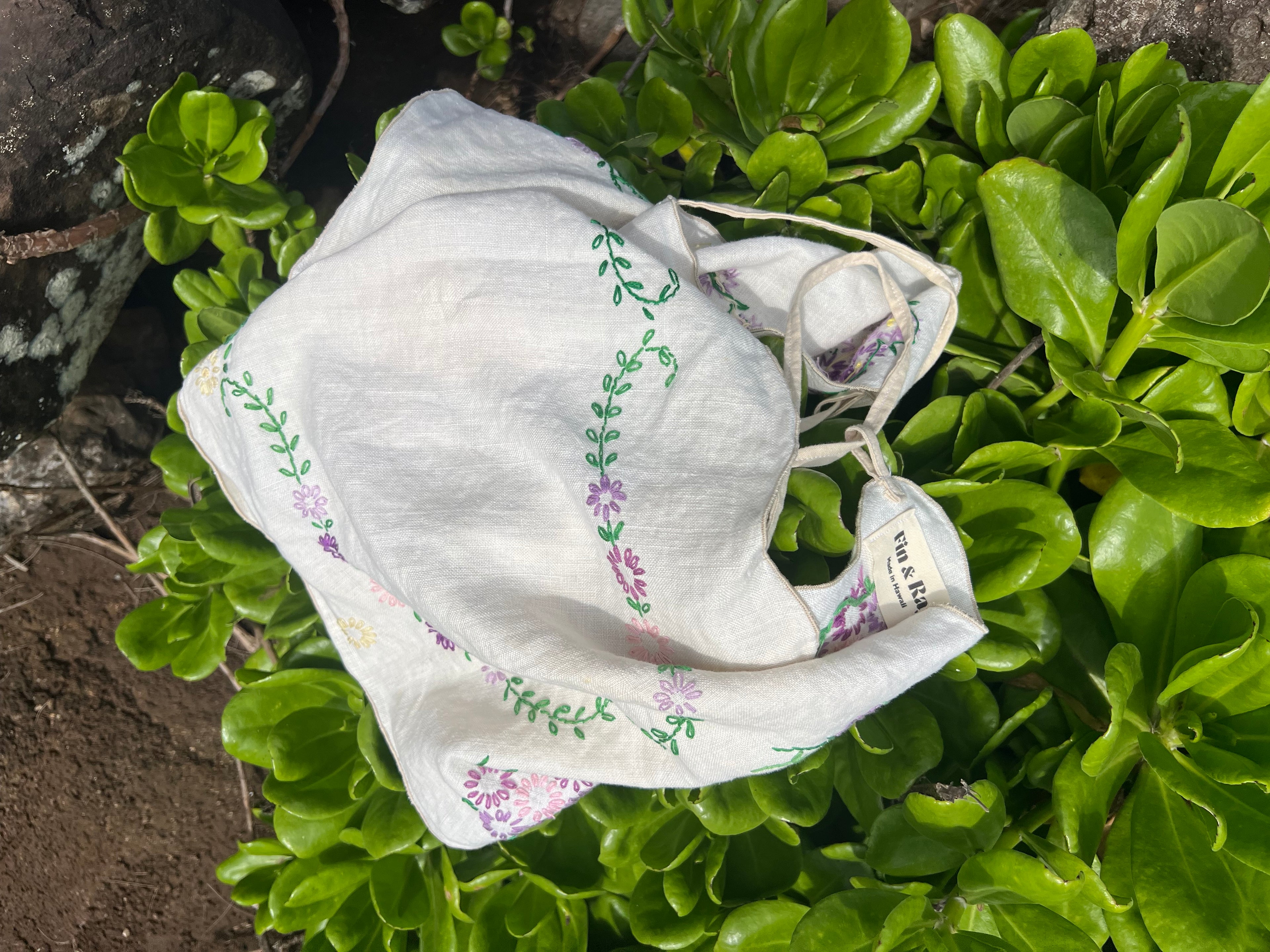 A floral embroidered tie back tank