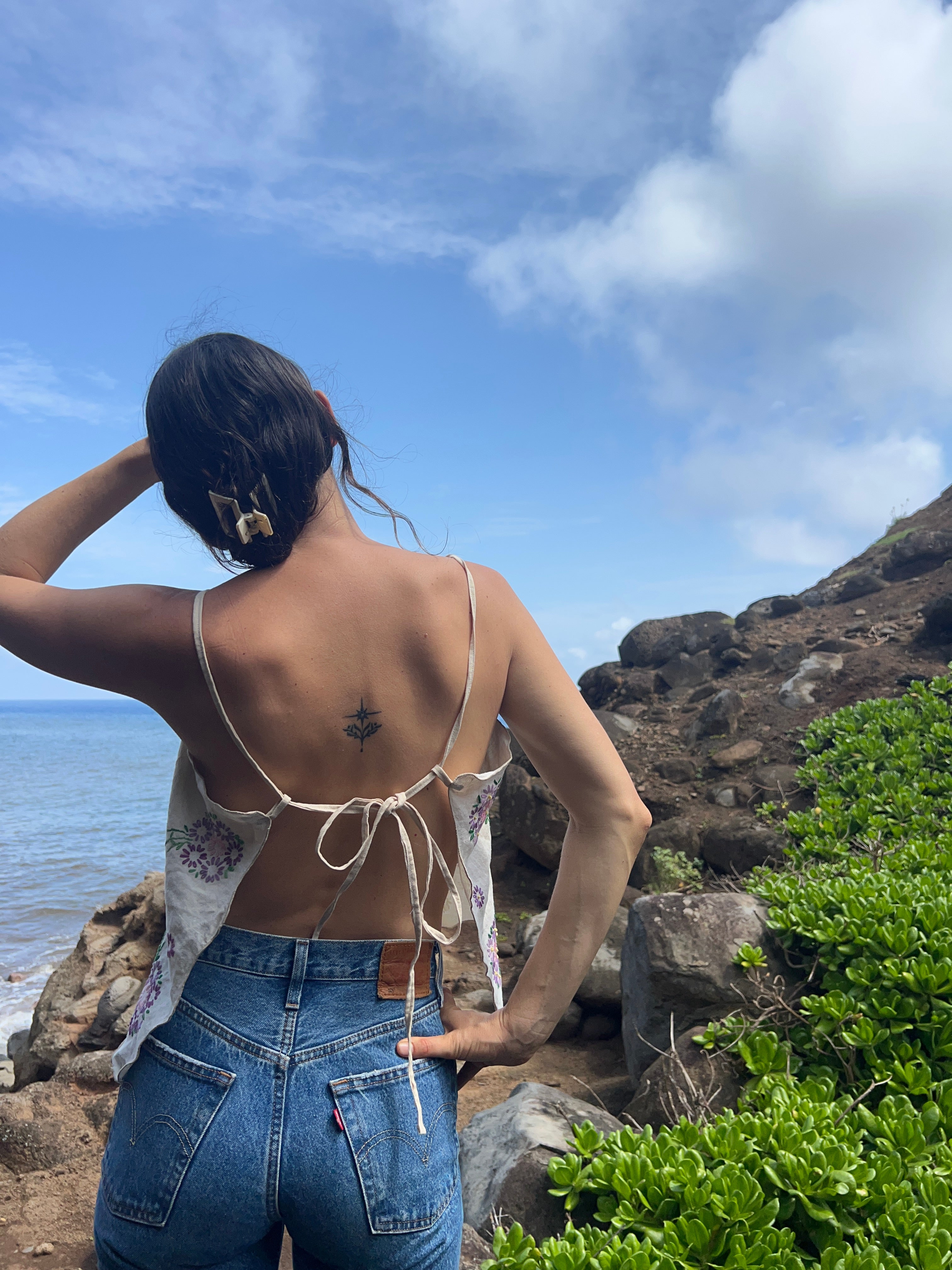A floral embroidered tie back tank