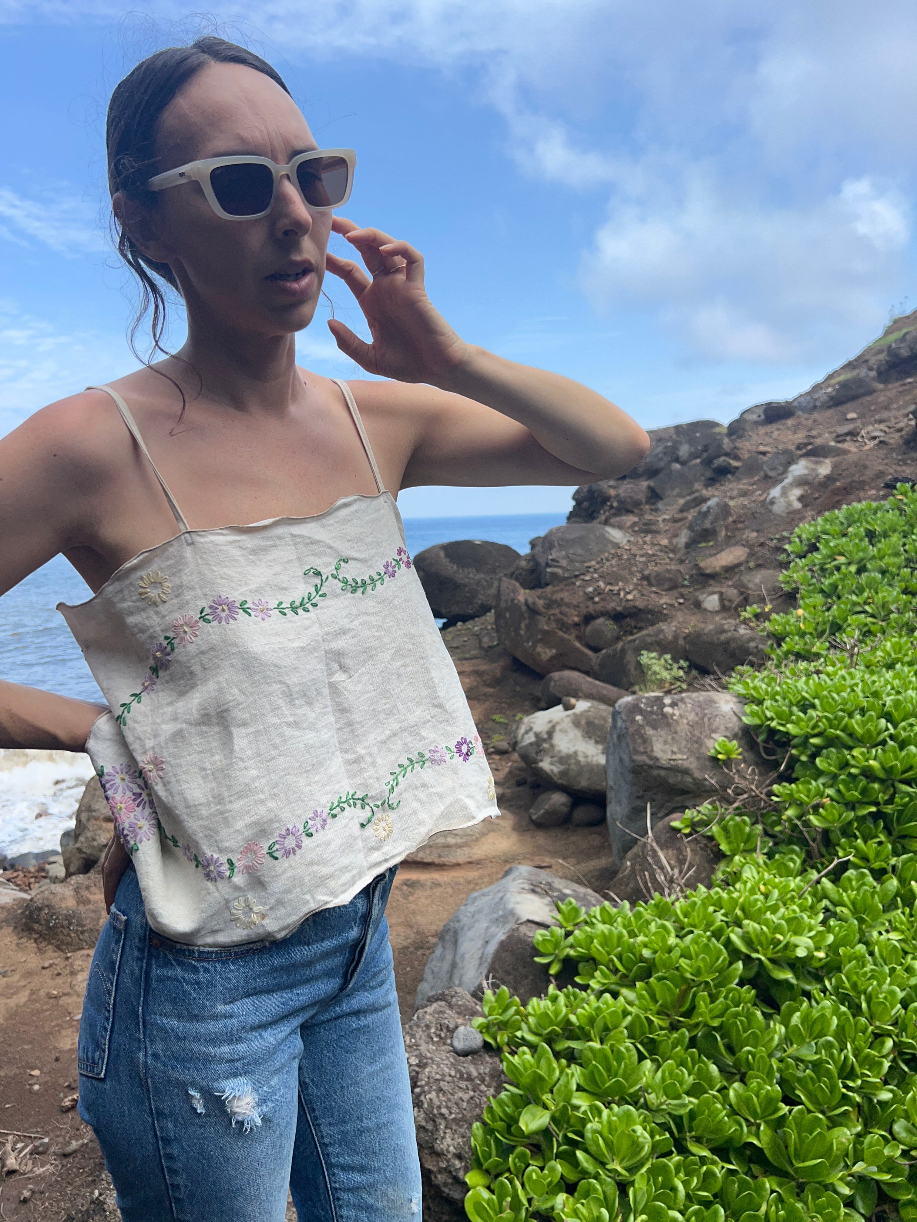A floral embroidered tie back tank