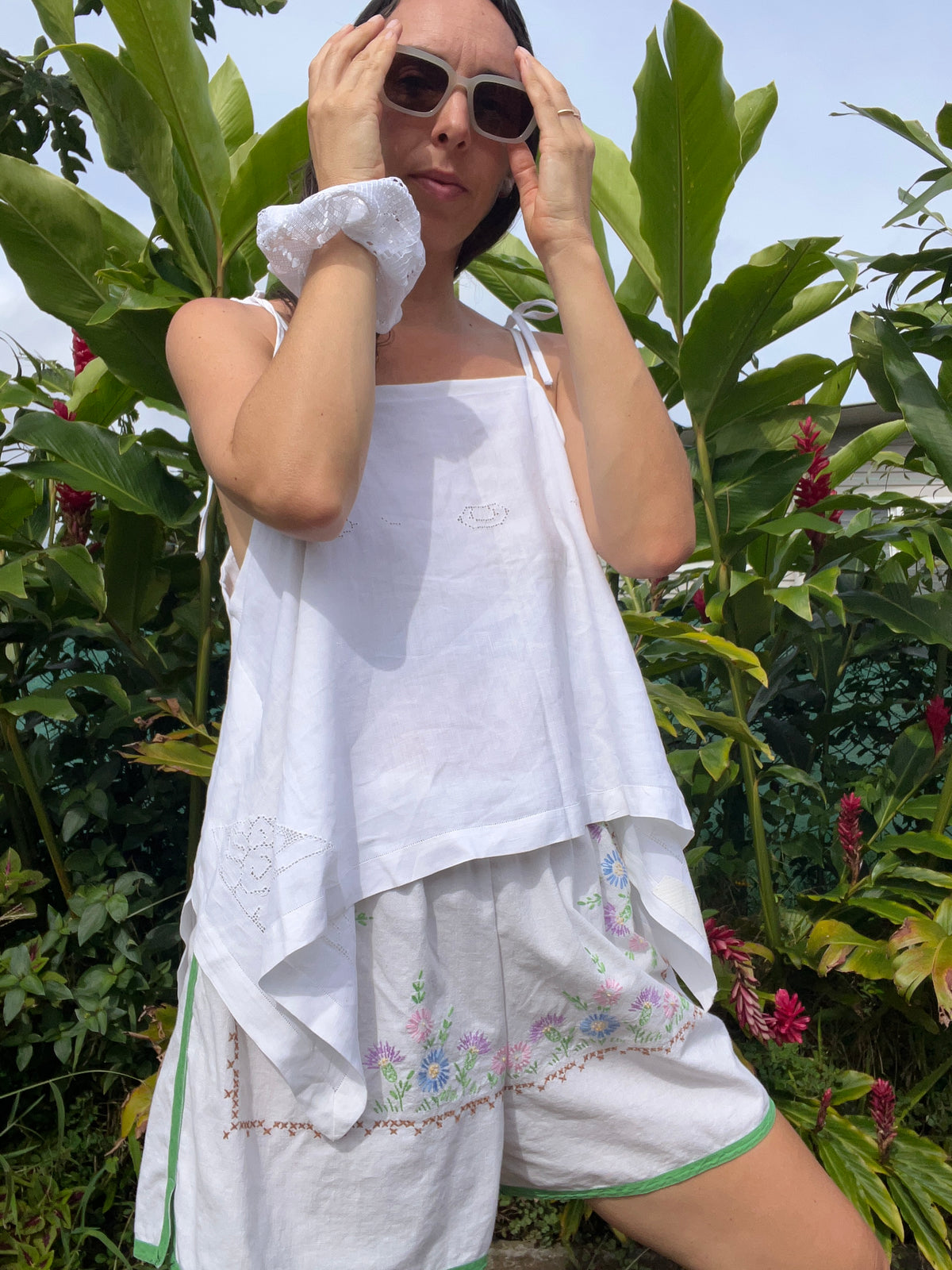 A delicate embroidered tie strap tank
